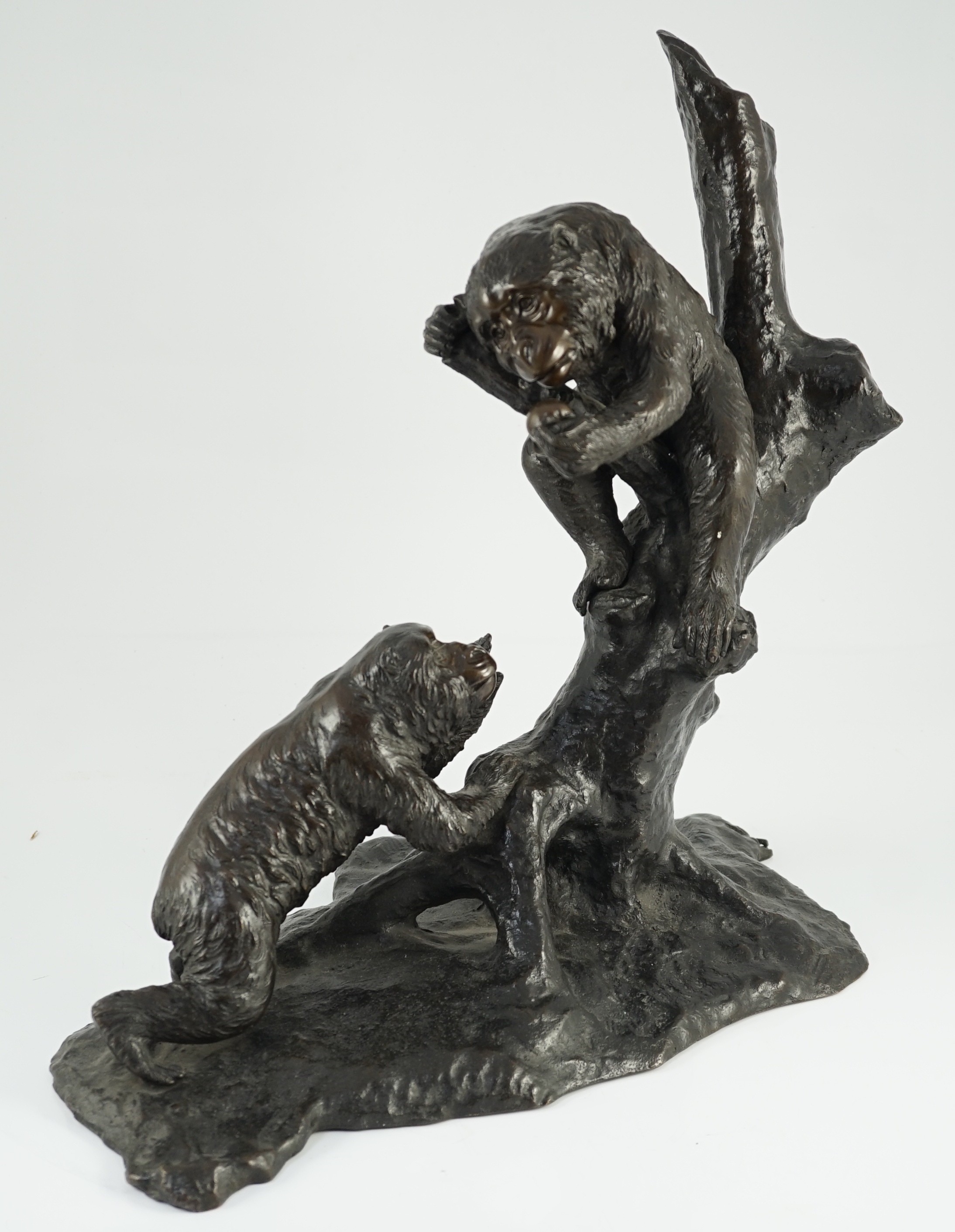 A large Japanese bronze group of two monkeys on a tree, by Genryusai Seiya, Meiji period, 42.5cm high, 43cm wide